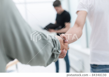 close up. business handshake in an office background 84348130