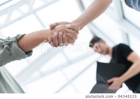 close up. business handshake over blurry background close up. business handshake over blurry background 84348133