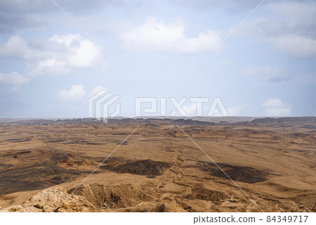 Ramon Crater Makhtesh Ramon, the largest in the world, as seen from the high rocky cliff edge surrounding it from the north, Ramon Nature reserve, Mitzpe Ramon, Negev desert, Israel Ramon Crater Makhtesh Ramon, the largest in the world, as seen from the high rocky cliff edge surrounding it from the north, Ramon Nature reserve, Mitzpe Ramon, Negev desert, Israel 84349717