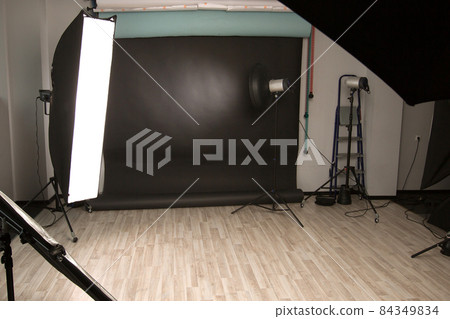 photo Studio with a variety of lighting equipment. photo with copy space 84349834