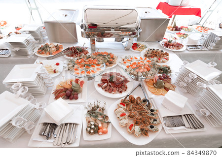 plates and dishes on the handout table in the restaurant 84349870