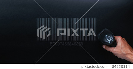 Barcode concept. Retail label barcode scan. Reader laser scanner for warehouse on black background. Warehouse inventory management. 84350314