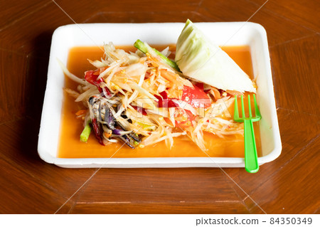 Papaya salad, Thai food name Som Tum, on white foam plate background 84350349