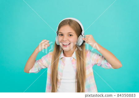 For pleasant musical exposure. Little girl child listening For pleasant musical exposure. Little girl child listening 84350883