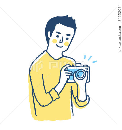 Smiley man holding a camera 84352024
