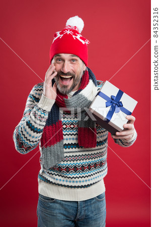 Buy gift. Bearded man in winter style. Caucasian man  84352316