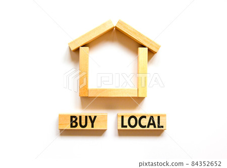 Buy local and house symbol. Concept words 'Buy local' on wooden blocks near miniature house. Beautiful white background, copy space. Business and buy local house concept. 84352652