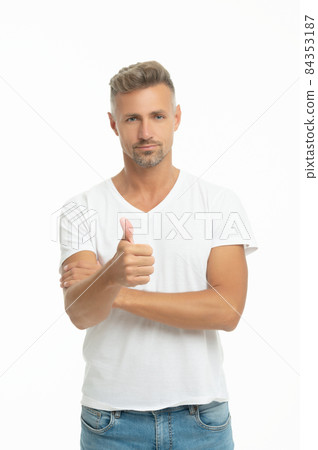 Thumbs up. Serious guy give thumb. Handsome man show approval sign. Thumbs up Thumbs up. Serious guy give thumb. Handsome man show approval sign. Thumbs up 84353187