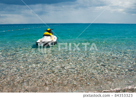 The jet ski parked on beautiful beach. The jet ski parked on beautiful beach. 84353323