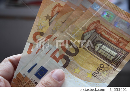 fifty euro banknotes spreaded on a table. Money, finance business concept 84353401