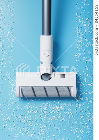 The turbo brush of the vacuum cleaner cleans white balls, top view on a blue background. The concept of cleanliness and cleaning. 84354155
