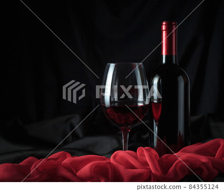 Bottle and glass with red wine. Bottle and glass with red wine. 84355124