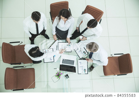 :successful business team shaking hands with new business partners after the conclusion of the financial contract in the conference room 84355583