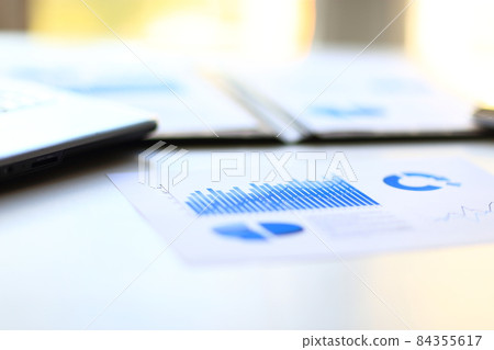 business background: financial statistics,notebook and pen on office workplace 84355617