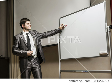speaker at business conferences standing in front of the Board for business presentations speaker at business conferences standing in front of the Board for business presentations 84356023