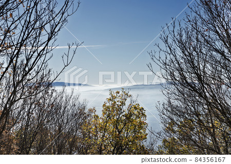 Landscape with clouds over mountains Landscape with clouds over mountains 84356167