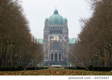 Koekelberg, Brussels Capital Region, Belgium - 11 19 2021: Low angle view of the Basilica of the Sacred Heart and the Elisabeth park in autumn 84356987