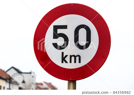 Koekelberg, Brussels Capital Region, Belgium - 11 19 2021: Road sign warning for a maximum of 50 kilometer per hour speed 84356992