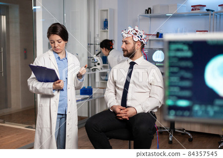 Specialist neurologist researcher monitoring brain evolution developing treatment Specialist neurologist researcher monitoring brain evolution developing treatment 84357545
