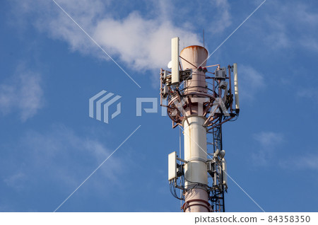 Cellular antennas and Internet on the brick pipe of the boiler room. Cellular antennas and Internet on the brick pipe of the boiler room. 84358350
