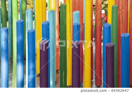 lumber painted in rainbow colours stands vertically lumber painted in rainbow colours stands vertically 84362647