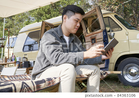 Young man, camping, campsite, travel, hobby, leisure, leisure, outdoor, camper, tent, tarp, camping equipment, Korean Young man, camping, campsite, travel, hobby, leisure, leisure, outdoor, camper, tent, tarp, camping equipment, Korean 84363106