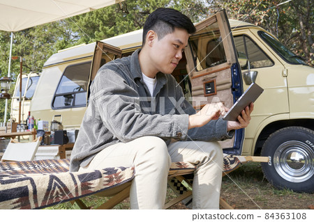 Young man, camping, campsite, travel, hobby, leisure, leisure, outdoor, camper, tent, tarp, camping equipment, Korean Young man, camping, campsite, travel, hobby, leisure, leisure, outdoor, camper, tent, tarp, camping equipment, Korean 84363108