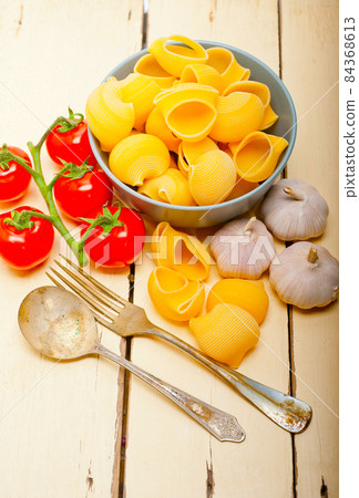 Italian snail lumaconi pasta with tomatoes 84368613