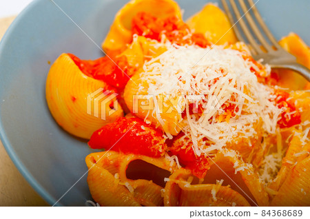Italian snail lumaconi pasta with tomatoes Italian snail lumaconi pasta with tomatoes 84368689
