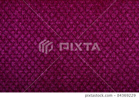 Purple fabric texture. Furniture upholstery textiles. Embossed pattern. Woven fibers. The material is soft touch. Minimalism concept. High detail macro photography for backgrounds or wallpapers. Purple fabric texture. Furniture upholstery textiles. Embossed pattern. Woven fibers. The material is soft touch. Minimalism concept. High detail macro photography for backgrounds or wallpapers. 84369229