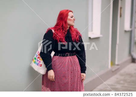 European plus size woman. Young red pink haired body positive girl 84372525