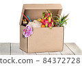 Tropical fruits in cardboard box isolated on white 84372728