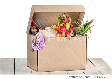 Tropical fruits in cardboard box isolated on white 84372728