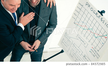 project Manager congratulating the employee on a successful presentation 84372985