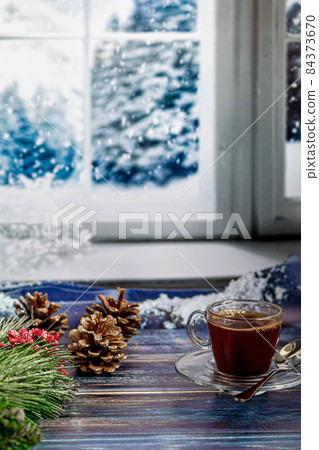 A cup of aromatic coffee with brown sugar, Christmas decorations, branches of a Christmas tree. Holiday concept New Year. On a wooden background. 84373670