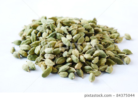 close up of Cardamom on a white background close up of Cardamom on a white background 84375044