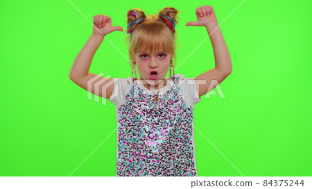 Happy funky blogger child kid girl, recording funny dancing video on smartphone for social network 84375244