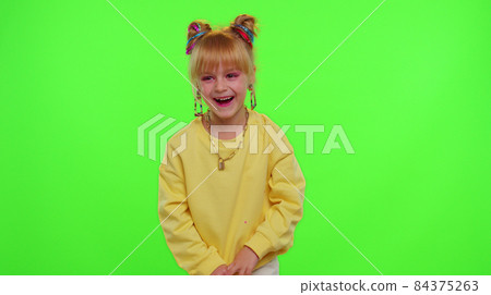 Happy funky blogger child kid girl, recording funny dancing video on smartphone for social network Happy funky blogger child kid girl, recording funny dancing video on smartphone for social network 84375263