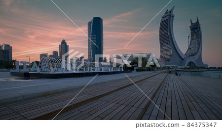 Lusail marina in Lusail city, Qatar at sunset with Yachts and boats ,Lusail skyline and clouds in the sky in  background 84375347