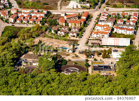 sewage treatment plant on the outskirts of the city, top view 84376907
