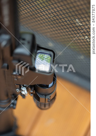 Close-up parts of automatic weapon with selective focus and blurred background Close-up parts of automatic weapon with selective focus and blurred background 84377875
