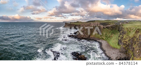 Dramatic sky above Dunluce Castle, County Antrim, Northern Ireland. 84378114