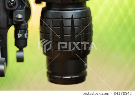 Close-up parts of automatic weapon with selective focus and blurred background 84378543