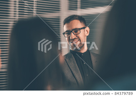business man shaking hands with his business partner . business man shaking hands with his business partner . 84379789