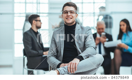 close up. financial consultant sitting in a modern office close up. financial consultant sitting in a modern office 84379849