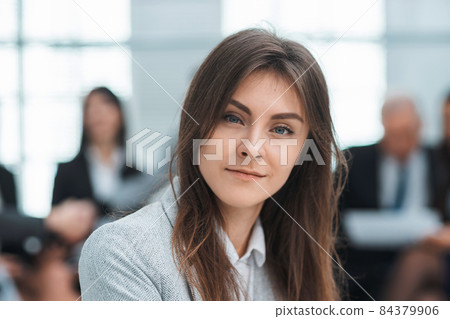 confident young business woman sitting in office 84379906