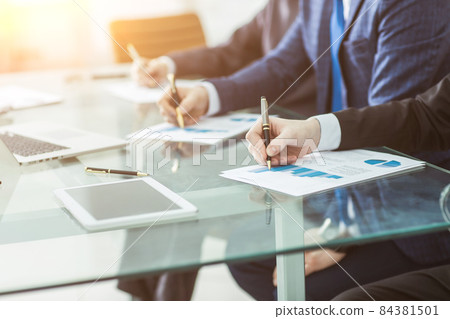 business team discussing a new financial plan of the company in the workplace business team discussing a new financial plan of the company in the workplace 84381501