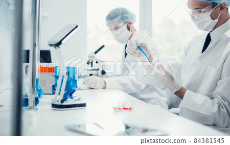 background image scientists are conducting research in the laboratory. background image scientists are conducting research in the laboratory. 84381545