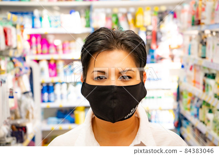 Happy natural asian woman in supermarket. Looking camera 84383046