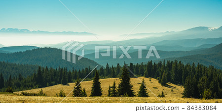 View from the side of Lake Belmeken to the Rila mountains and the peaks of the Pirin mountains in the fog View from the side of Lake Belmeken to the Rila mountains and the peaks of the Pirin mountains in the fog 84383084
